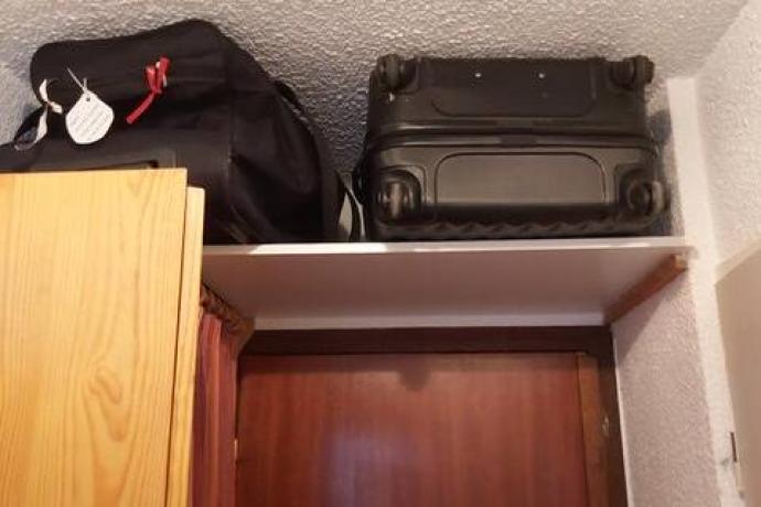 Rangement pour valise